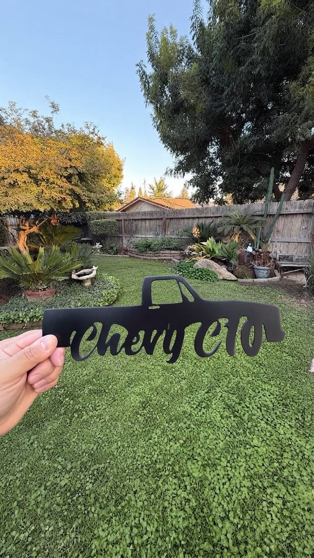 A steel silhouette of a classic Chevy C10 truck above the words Chevy C10.