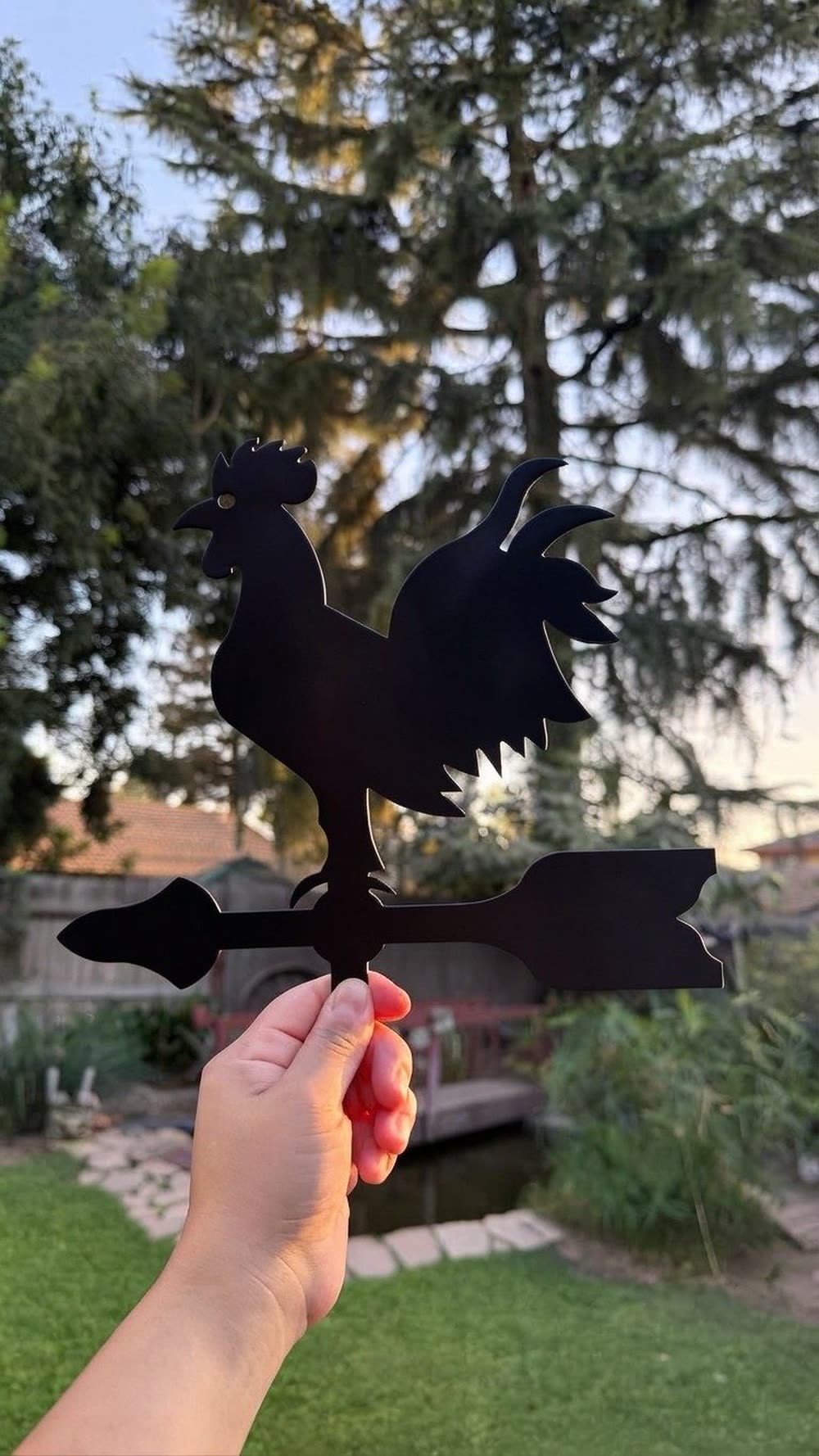 A steel rooster standing on an arrow.